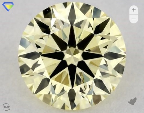 James Allen's Exquisite Selection - A 0.74 Carat Round Lab-Created Diamond, boasting a vibrant Fancy Yellow hue and SI2 Clarity. This captivating gem combines the allure of unique color with the brilliance of expert craftsmanship, making it a standout choice for those seeking a distinctive and eye-catching piece.